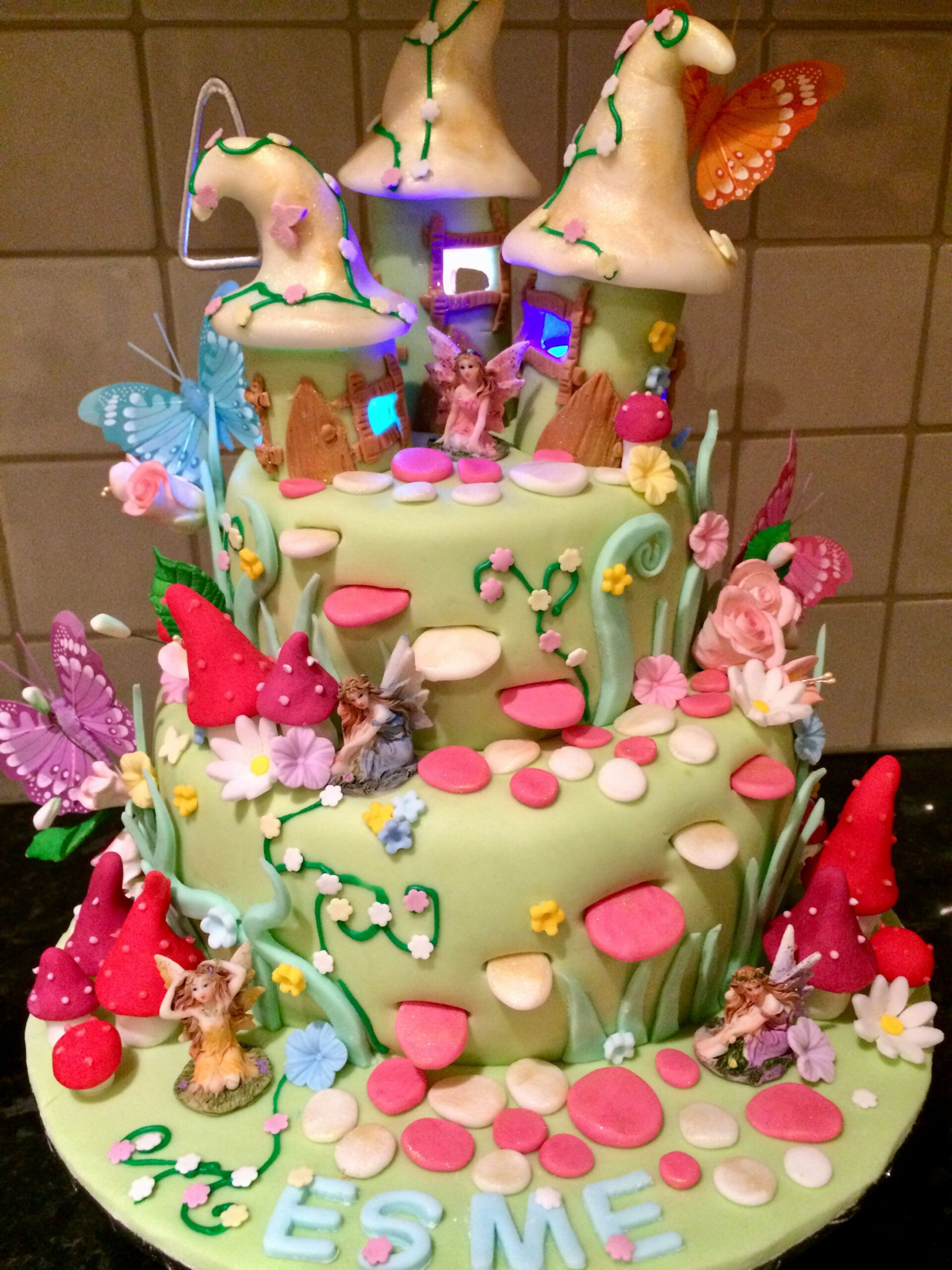 Enchanted fairy garden birthday cake with light up fairy houses