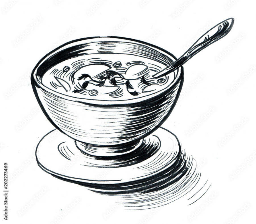 A bowl of soup with a spoon