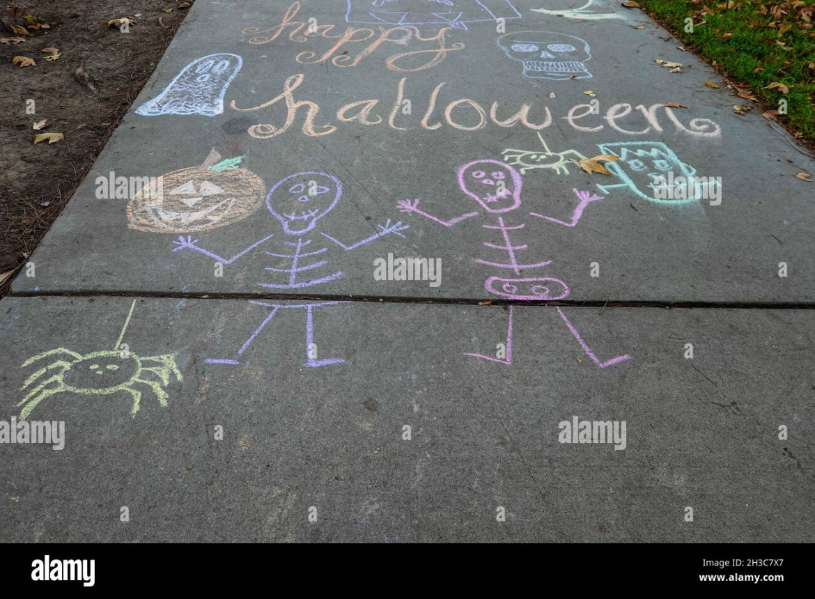 Happy Halloween funny sidewalk chalk drawing Stock Photo - Alamy